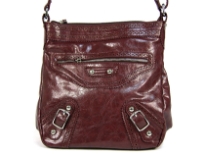 Messenger Bag made of Polyurethane material has top zipper closure with adjustable straps & also has a front zipper pocket.It is also accentuated with belt buckle straps and diamond studs.