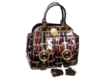 Double strapped PVC Fashion Handbag made with multiple extra outer compartments and buckles. Magnetic closure on top.