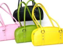 Designer Inspired Handbag has a top zipper closure and double handle. Made of nylon.