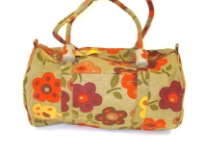 Beach bag has a floral pattern, a top zipper closure and double shoulder straps.  Made of 100% Cotton.  