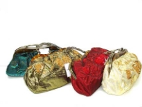 Shimmery Fabric Embroidered Evening bag. It has metal handle with clasp lock.