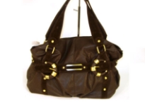 Glossy PVC fashion handbag with straps accent in suede fabric. Double shoulder straps with top zipper closure.