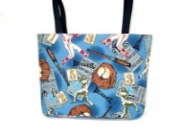 Sports Bucket Bag with double shoulder handle, magnetic clasp closure, one cell phone pocket & one zipper pocket inside the bag. Made in USA.