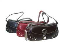 PVC fashion handbag embellished with metalic studs along the front side.  Made with a push lock closure and a single shoulder strap. 