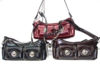 Shoulder bag has a single strap with chain detail, a top zipper closure, and outside pockets with twist lock closure. R-64 PVC Material.