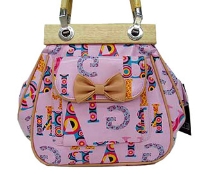 Fashionable shoudler bag has a multi color letter pattern, a top zipper closure, a double handle, and an outside pocket with bow detail. Made of faux leather.