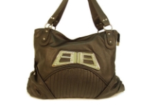 Designer Inspired Shoulder Bag with accentuating metal design. Bag has a zipper closure and a double handle. Made of polyurethane.