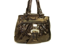 Fashion Handbag made of polyurethane material. This is a double strap bag with belt buckle like straps and a top zipper closure. 