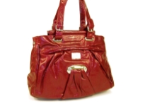 Fashion Handbag is made of polyurethane material. This double strap bag has a belt buckle on both of the straps and a zipper closure on the top.