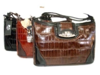 Genuine Leather handbag with clasp over zipper closure.
