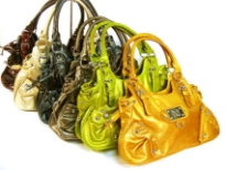 Designer Inspired Metallic Hobo Handbag has a zipper closure and a double handle. Belt detail along the straps. Made of PU (polyurethane).