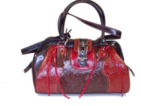 Genuine Leather bag with top zipper closure, double handle & clasp like closure over the top.