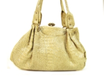 Croco Embossed PVC Fashion Handbag has a kiss lock closure and a double handle.