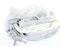 Crinkled & ruffled light hued scarf in white color with shiny off-white color running vertically through it in the middle. Fringes on the ends completes this stylish scarf.
