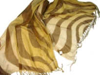 Lightweight Shaded Polyester scarf in shades of gold with brown waves over it. Fringes on its ends. Imported.
