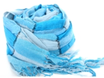Checkered turquoise & sky blue 100% polyester woven scarf which is crinkled as well as stretchable. Silver lining running through the scarf vertically. Twisted fringes on its ends. Hand wash. Imported.