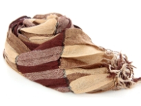 Checkered brown & tan 100% polyester woven scarf which is crinkled as well as stretchable. Silver lining running through the scarf vertically. Twisted fringes on its ends. Hand wash. Imported.