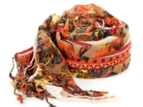 Orange Floral Print 100% wool scarf with multi-colored flowers and beige colored border. Hanging fringe at the edges. Imported. 100% wool.