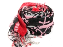 Nautical symbology floats over this 100% wool scarf in pink, red & black colors. The scarf has boats & anchors figure floating over with twisted fringes at the ends. Dry clean only. Imported. 