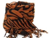 Abstract artistic lines travel over this two-tone rich colored scarf in rust & black colors tipped with twisted fringe. 100% wool scarf; imported. Dry clean only. 