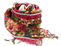 Add a punch of color with this black wool scarf patterned with floral design in red, yellow & green colors and cream colored border along the vertical length. Hanging fringe decorates the ends. 100% woolen scarf. Hand wash. Imported. 