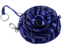 Faux leather zebra print clutch bag has zipper closure and a detachable metal chain. 