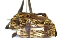 Tiger Pattern Faux Fur Bag has top zipper closure, adjustable belted double handle, two open side pockets & open pocket in the middle front. 