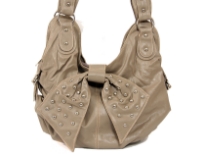 Fashion Hobo bag has a top zipper closure, a double handle and a studded bow detail. Made of faux leather.