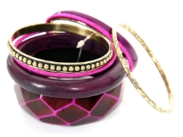 Rich colored attractive 8 piece bangles set has wide cuff diamond pattern bangle, one rounded wooden bangle, 2 fabric bangles, 1 purple resin bangle & 3 gold color each having its own etched design. Hand crafted by experts in India.