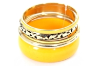 This is a 5 piece bangle bracelet set. Hand painted by experienced artisans. This piece features one wide bracelet in Yellow color along with smaller pieces in Gold and Yellow. Imported.