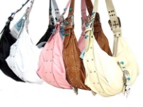 This hobo bag is made of faux leather it has a soft buckle with Turquoise embelishd diamond studs underlining the purse and a top zipper closure with an adjustable strap.