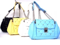 Designer inspired shoulder bag has a single strap with double chain detail. Bag has a push lock closure and a checkered pattern design. Bag is  made of faux leather.