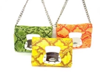 Designer inspired shoulder bag has a magnetic closure, a chan strap and an animal print pattern. Made of faux leather.