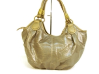 Designer Inspired Hobo Shoulder Bag with metallic texture, zipper closure and a double handle. Made of PU (polyurethane).