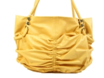 Spacious fashion shoulder bag has a ruched front, top zipper closure and a double handle. Made of PU.