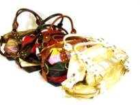 Designer Inspired Handbag with metallic patchwork design has a zipper closure and a double handle. Made of PU (polyurethane).