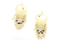 Black beads on Golden earrings.