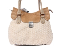 Shoulder bag is adorned with abstract fabric mini roses, has a double handle, top zipper closure and an elegant twist lock closure. Made of PVC.