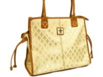 Fleur De Liz Licensed Jacquard Handbag. This spacious bag in jacquard material has leather trim bordering the bag & also hanging tussles on the sides. Top zipper closure.