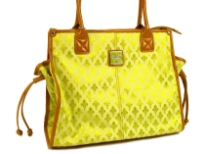 Fleur De Liz Licensed Jacquard Handbag. This spacious bag in jacquard material has leather trim bordering the bag & also hanging tussles on the sides. Top zipper closure.