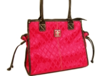 Fleur De Liz Licensed Jacquard Handbag. This spacious bag in jacquard material has leather trim bordering the bag & also hanging tussles on the sides. Top zipper closure.