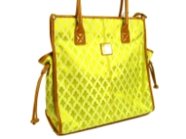 Fleur De Liz Licensed Jacquard Handbag. Double Handle & top zipper closure in leather. Two side pockets outside the bag with hanging leather strands & outside zipper pocket. Leather trim borders the bag.