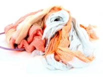 Crinkled Two Tone Woven Polyester Scarf with eyelash fringes all around it. Soft and lightweight to use & comes on a small round hanger. Imported. 100% polyester.