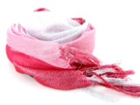 This lightweight 50% viscose & 50% polyester scarf in red, pink & white shades with silver stripes running through it can be used all year around to give an edge to your outfit. Long knotted tussels on its edges. Imported.