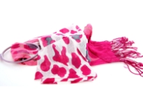White & Fuchsia Cow Print 100% Viscose Scarf with Fuchsia & Pink Colored Ends. Twisted fringes on the ends. Lightweight and very soft to use. Imported. 