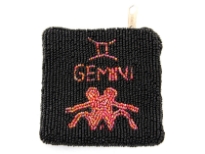 Hand Beaded coin purse. Top zipper closing.