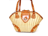 Wicker Flap Tote assembled with double shoulder straps made with metalic hardware. 