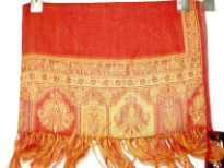 100% Pure Wool Jamawar Shawl in Red color with artistic pattern in gold color on the border. Threads like fringes on the ends of the shawl. Imported.