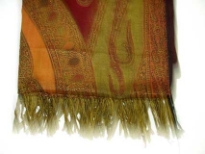 Multi Colored 100% Pure Wool Jamawar Shawl with shades of green, red & orange. Threads like fringes on the edges of the shawl. Imported.