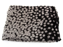 A duo of complementary hues dramatically shade this lightweight polyester scarf patterned with always-classic polka dots. Dense polka dots on one end of the scarf gives an edge to this essential scarf.